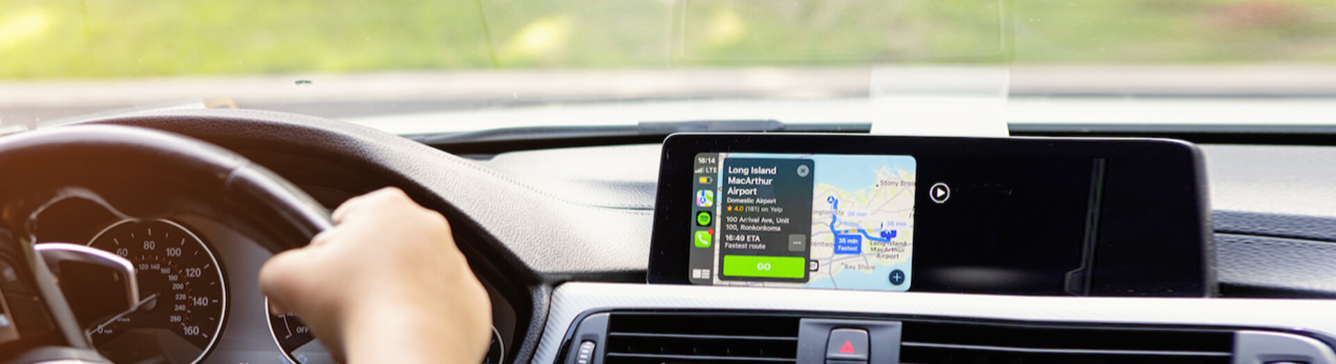 Image of person driving vehicle with GPS on dashboard