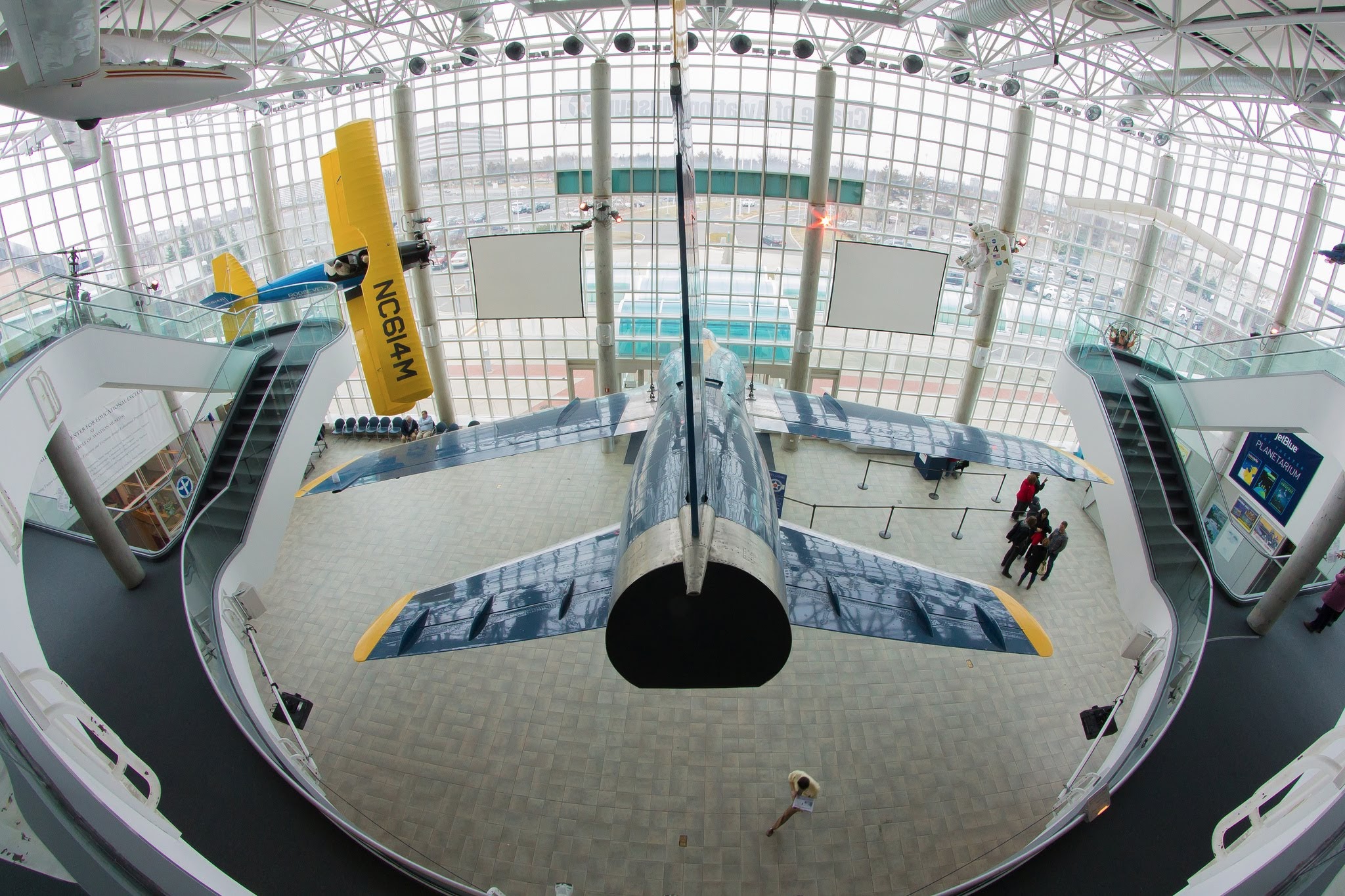 Image of plane hanging from ceiling in cradle of aviation museum