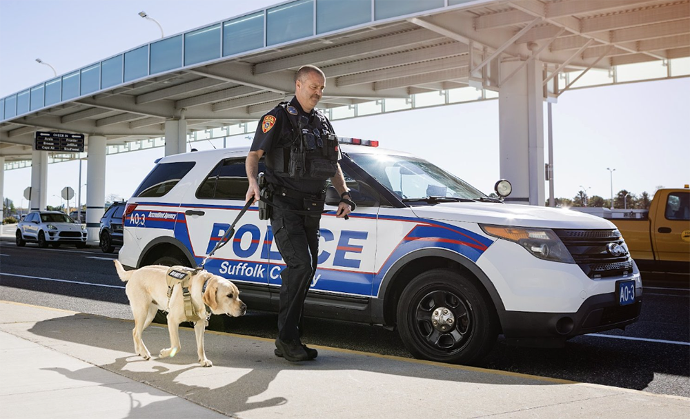 A Frontier airplane sitting on the runway at Long Island MacMarthur Airport